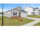 Attractive single-level home with a manicured lawn, an attached two-car garage, and conventional styling at 8593 Preakness Pass, Lithonia, GA 30058