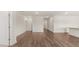 A bright hallway with hardwood floors and white walls at 8593 Preakness Pass, Lithonia, GA 30058