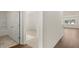 Spacious interior showcasing modern finishes, a tiled bathroom, and natural light, creating a cozy and welcoming atmosphere at 8593 Preakness Pass, Lithonia, GA 30058