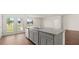A kitchen island with granite countertops and stainless steel sink at 8593 Preakness Pass, Lithonia, GA 30058