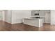 A modern kitchen with gray cabinets and hardwood floors at 8593 Preakness Pass, Lithonia, GA 30058