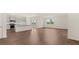 An open living room and kitchen with hardwood floors at 8593 Preakness Pass, Lithonia, GA 30058
