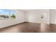 A bright living room with hardwood floors and a view of the neighborhood at 8593 Preakness Pass, Lithonia, GA 30058