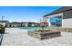 Community pool with stone retaining wall planter, outdoor grilling area and covered lounging at 8593 Preakness Pass, Lithonia, GA 30058