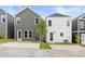 Back exterior view showcasing modern, two-story homes with individual backyards and private driveways at 589 Federal Se Ter, Atlanta, GA 30315