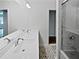 Bathroom featuring dual vanity, chrome faucets, and a shower with glass doors at 2122 Belhaven Se Ln, Atlanta, GA 30315