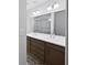 Bathroom with a dual-sink vanity, a large mirror, and a walk-in shower behind glass at 2122 Belhaven Se Ln, Atlanta, GA 30315