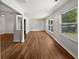 Bright living room featuring gleaming hardwood floors and ample natural light from large windows at 2122 Belhaven Se Ln, Atlanta, GA 30315