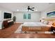 Spacious main bedroom with a ceiling fan and soft natural light creating a relaxing atmosphere at 2122 Belhaven Se Ln, Atlanta, GA 30315