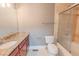 Bathroom with granite countertop, a shower/tub combo, and a toilet at 799 Hammond Dr # 406, Atlanta, GA 30328