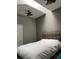 Spacious bedroom with a white duvet and ceiling fan at 799 Hammond Dr # 406, Atlanta, GA 30328