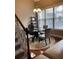 Bright dining area with glass table and four chairs at 799 Hammond Dr # 406, Atlanta, GA 30328