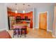 The kitchen features stainless appliances, wood cabinets and an island at 799 Hammond Dr # 406, Atlanta, GA 30328