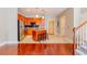 Open kitchen with stainless appliances, kitchen island, and adjacent staircase at 799 Hammond Dr # 406, Atlanta, GA 30328
