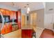 Eat-in kitchen with a center island, stainless appliances, wood cabinets, and a tile floor at 799 Hammond Dr # 406, Atlanta, GA 30328