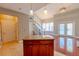 Open floor plan with combined kitchen and living area featuring access to outdoor patio at 799 Hammond Dr # 406, Atlanta, GA 30328