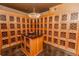 Shared wine storage with numerous individual wooden lockers at 799 Hammond Dr # 406, Atlanta, GA 30328