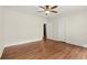 Bedroom showcasing hardwood floors, ceiling fan and access to a closet at 1789 Thompson Ave, Atlanta, GA 30344