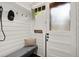 Inviting mudroom with shiplap walls, bench seating, and charming details by the front door at 1789 Thompson Ave, Atlanta, GA 30344