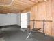 Unfinished basement space for exercise with exposed wood framing and plumbing at 1269 Heritage Dr, Villa Rica, GA 30180