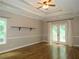Spacious bedroom features wood floors, ceiling fan, and French doors at 1269 Heritage Dr, Villa Rica, GA 30180