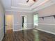Large bedroom features wood floors, tray ceiling, and ensuite bath at 1269 Heritage Dr, Villa Rica, GA 30180