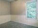Cozy bedroom with carpet, a large window and paneled walls, a comfortable retreat at 1269 Heritage Dr, Villa Rica, GA 30180