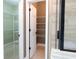Spacious walk-in closet with wire shelving and a door leading to the bathroom shower at 1269 Heritage Dr, Villa Rica, GA 30180