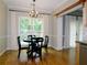 Inviting dining area with hardwood floors and a bright window overlooking the backyard at 1269 Heritage Dr, Villa Rica, GA 30180