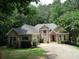 Two-story brick home with attached garage and lush landscaping at 1269 Heritage Dr, Villa Rica, GA 30180