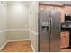 View into a kitchen featuring stainless steel appliances and wooden cabinets at 1269 Heritage Dr, Villa Rica, GA 30180