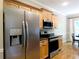 Kitchen featuring stainless steel appliances, granite countertops, and wood floors at 1269 Heritage Dr, Villa Rica, GA 30180