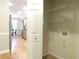 Laundry room with door, washer hookups, and overhead shelving for easy storage at 1269 Heritage Dr, Villa Rica, GA 30180