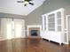 Bright living room with fireplace, built-in shelving, and hardwood floors at 1269 Heritage Dr, Villa Rica, GA 30180
