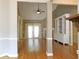 Open-concept living room featuring hardwood floors, built-in shelving, and a fireplace at 1269 Heritage Dr, Villa Rica, GA 30180