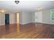 Spacious living room with beautiful hardwood floors, neutral paint, and bright natural light at 1269 Heritage Dr, Villa Rica, GA 30180