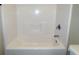Shower and tub combination featuring white fiberglass and chrome shower head at 1269 Heritage Dr, Villa Rica, GA 30180
