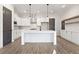 Bright, stylish kitchen featuring a large island, white cabinets, and stainless steel appliances at 947 Willingham Dr # 2, Hapeville, GA 30354