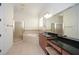Bathroom with large vanity, framed mirror, soaking tub, and glass enclosed shower at 705 Springer Mountain Dr, Canton, GA 30114