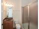 Bathroom with a framed glass shower, granite vanity, and modern fixtures for a stylish look at 705 Springer Mountain Dr, Canton, GA 30114