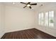 Bright bedroom with wood floors, crown molding, and shuttered windows at 705 Springer Mountain Dr, Canton, GA 30114