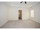 Spacious bedroom features tray ceiling, neutral carpet, and plantation shutters at 705 Springer Mountain Dr, Canton, GA 30114