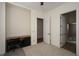 Cozy bedroom, desk, ensuite bathroom, and neutral walls with bright white trim and doors at 705 Springer Mountain Dr, Canton, GA 30114
