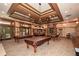 Resident billiards room with three tables, coffered ceiling and neutral color palette at 705 Springer Mountain Dr, Canton, GA 30114