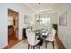 Dining room with marble table, stylish decor, hardwood floors, and modern light fixture at 705 Springer Mountain Dr, Canton, GA 30114