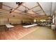 Spacious event space featuring hardwood floors, elegant lighting, and tables for gatherings and entertainment at 705 Springer Mountain Dr, Canton, GA 30114