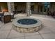 Stone outdoor fire pit area with comfortable seating and a well-paved patio at 705 Springer Mountain Dr, Canton, GA 30114