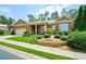 Well-maintained brick home with a manicured lawn and stone accents at 705 Springer Mountain Dr, Canton, GA 30114