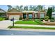 Charming brick home featuring a well-manicured lawn and an inviting covered entryway at 705 Springer Mountain Dr, Canton, GA 30114