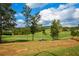 Lush green golf course offering a recreational activity for golf enthusiasts to enjoy at 705 Springer Mountain Dr, Canton, GA 30114